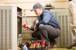 Repair man working on AC