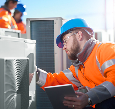 A/C Professional examining heating unit