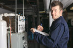 Repairman holding clipboard