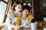 Two women using smart phone