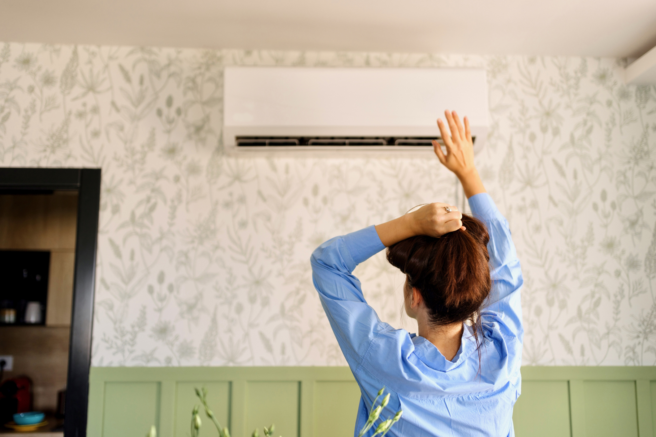 Woman checking AC